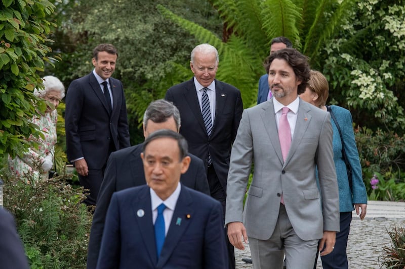ST AUSTELL, ENGLAND - JUNE 11:  German Chancellor Angela Merkel, French President Emmanuel Macron,  Japanese Prime Minister Yoshihide Suga, Queen Elizabeth II, Canadian Prime Minister Justin Trudeau, Italian Prime Minister Mario Draghi,and United States President Joe Biden arrive for a drinks reception for Queen Elizabeth II and G7 leaders at The Eden Project during the G7 Summit on June 11, 2021 in St Austell, Cornwall, England. UK Prime Minister, Boris Johnson, hosts leaders from the USA, Japan, Germany, France, Italy and Canada at the G7 Summit. This year the UK has invited India, South Africa, and South Korea to attend the Leaders' Summit as guest countries as well as the EU. (Photo by Jack Hill - WPA Pool / Getty Images)