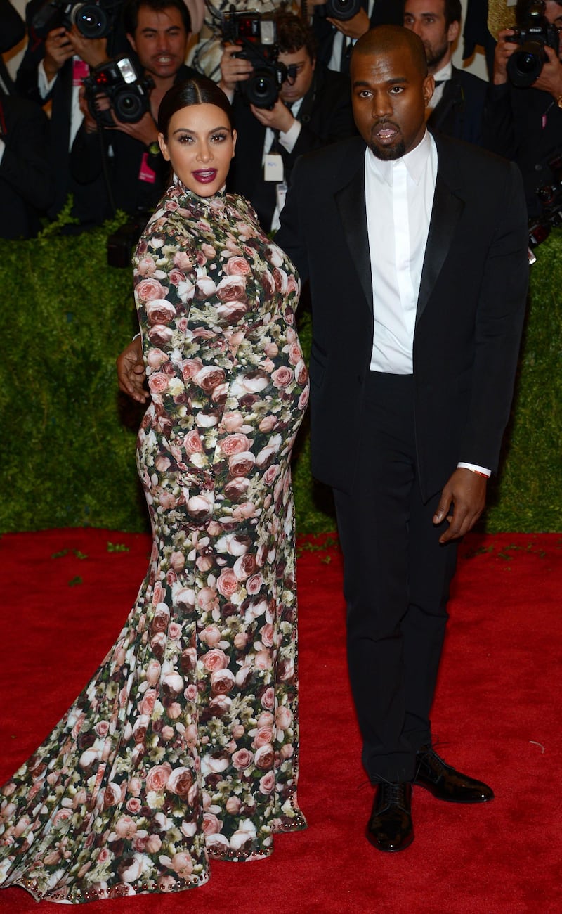 epa03690115 US cocialite Kim Kardashian (L) and musician Kanye West attend the 'Punk: Chaos to Couture' Costume Institute Gala at the Metropolitan Museum of Art in New York, New York, USA, 06 May 2013.  EPA/JUSTIN LANE
