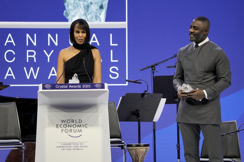 Actor Idris Elba, right, and his wife Sabrina Dhowre Elba, left, smile on the podium during the Crystal Award ceremony. AP