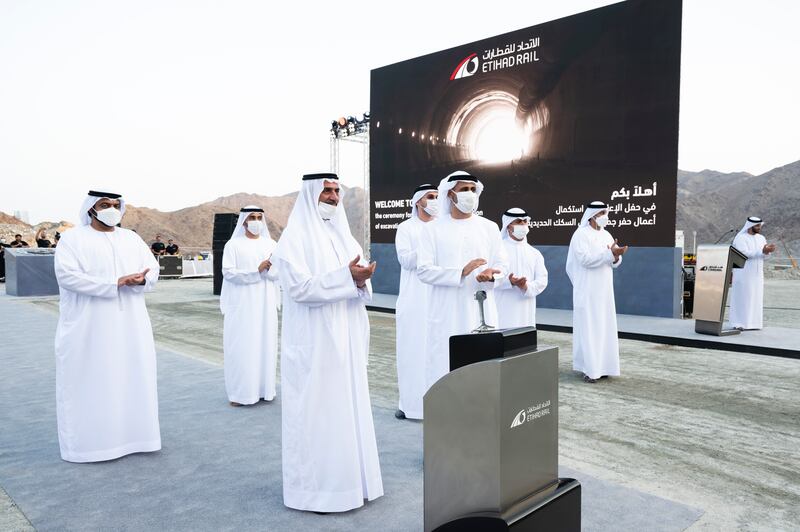 Sheikh Hamad bin Mohammed, right, and Sheikh Theyab bin Mohamed, left, celebrate the completion of a 6.9km tunnel excavation.