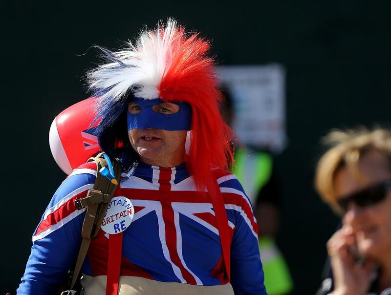 A friend dressed in the Union Jack attends the final day of Dubai Rugby Sevens on Saturday. Satish Kumar / The National