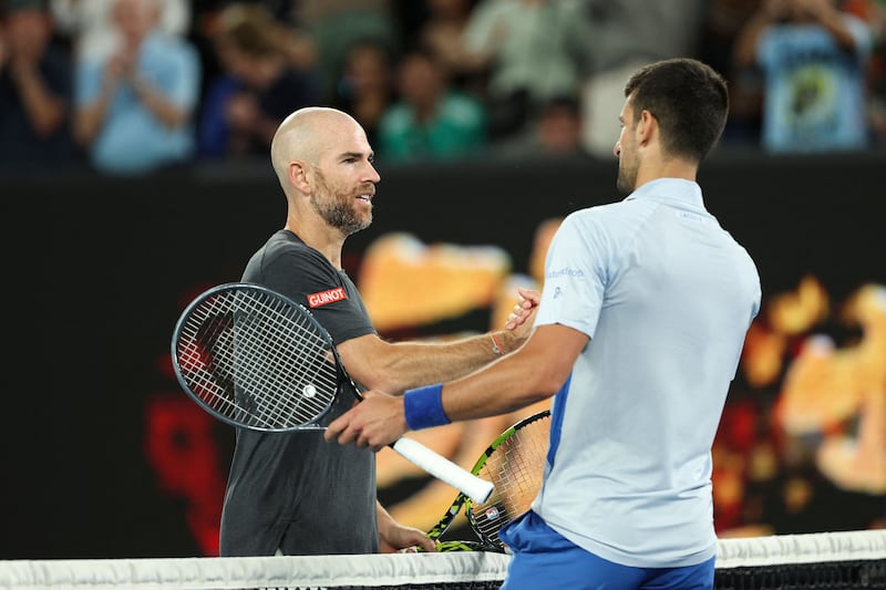 Novak Djokovic shakes hands with Adrian Mannarino after their match at the Australian Open. AFP