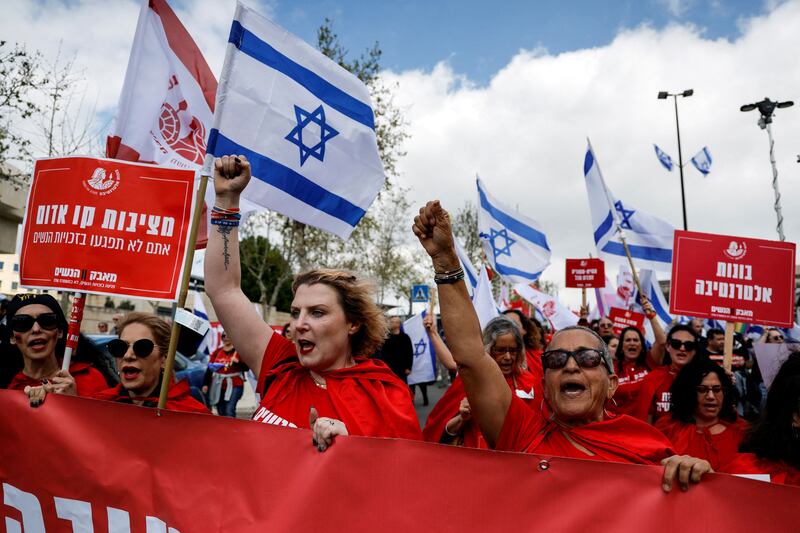 Women dressed as handmaidens from 'The Handmaid's Tale' attend a demonstration in Jerusalem on Monday. Reuters