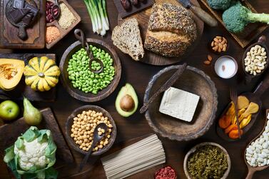 A selection of healthy vegan food, including fruit vegetables, tofu and beans. Getty Images