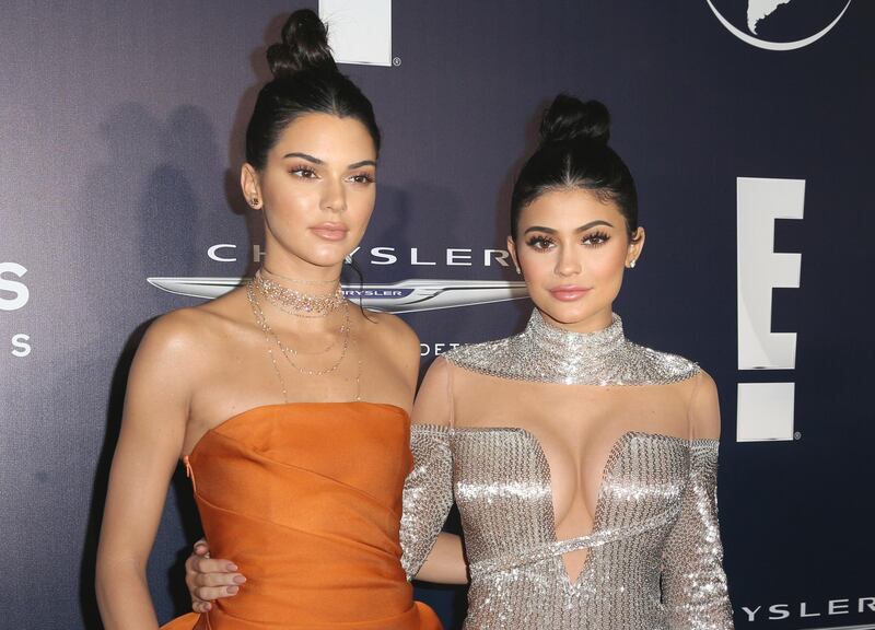 Kylie Jenner, right, seen with her sister Kendall are members of the celeb Kardashian-Jenner clan, who are known for their prolific pull over social media. Rich Fury / Invision / AP File