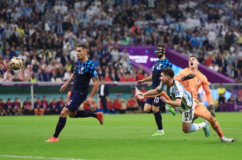 Croatia's Dominik Livakovic fouls Julian Alvarez, leading to the penalty. Getty