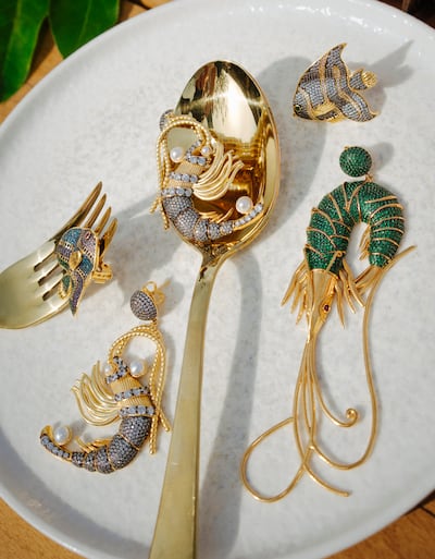 Inspired by shrimps and fish, earrings made from 24 karat gold-plated bronze, encrusted with crystals, by Begum Khan. Photo: Begum Khan