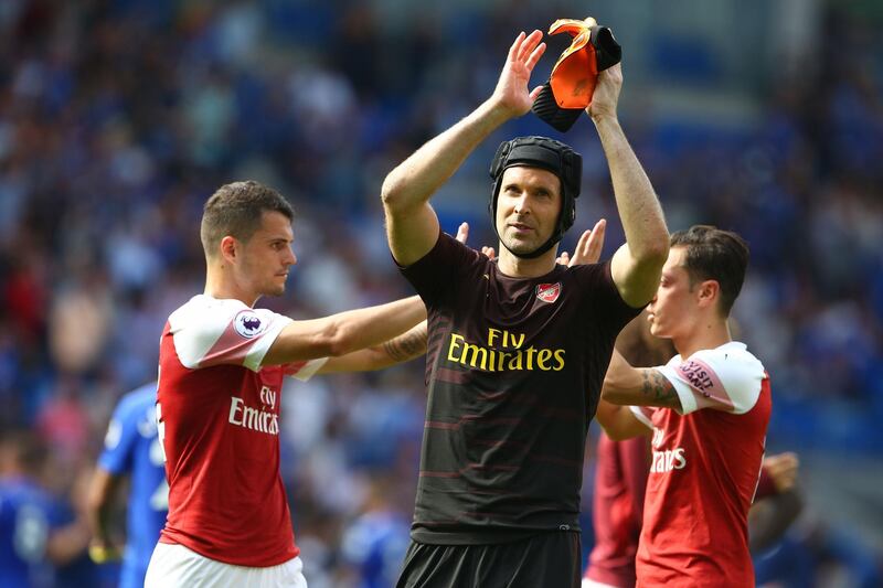Arsenal's Czech goalkeeper Petr Cech applauds supporters on the pitch after the English Premier League football match between between Cardiff City and Arsenal at Cardiff City Stadium in Cardiff, south Wales on September 2, 2018. - Arsenal won the game 3-2. (Photo by Geoff CADDICK / AFP) / RESTRICTED TO EDITORIAL USE. No use with unauthorized audio, video, data, fixture lists, club/league logos or 'live' services. Online in-match use limited to 120 images. An additional 40 images may be used in extra time. No video emulation. Social media in-match use limited to 120 images. An additional 40 images may be used in extra time. No use in betting publications, games or single club/league/player publications. / 