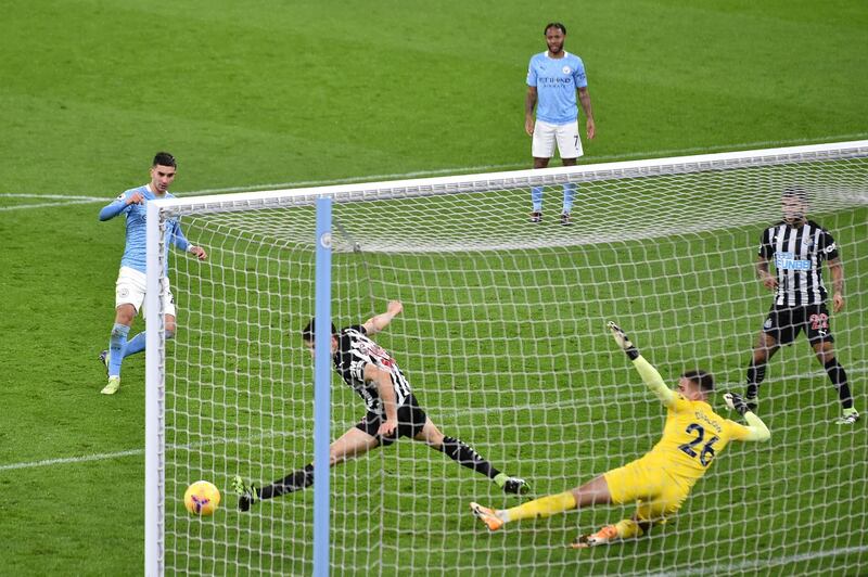 MANCHESTER, ENGLAND - DECEMBER 26: Ferran Torres of Manchester City scores his team's second goal past Karl Darlow of Newcastle United during the Premier League match between Manchester City and Newcastle United at Etihad Stadium on December 26, 2020 in Manchester, England. The match will be played without fans, behind closed doors as a Covid-19 precaution. (Photo by Peter Powell -Pool/Getty Images)