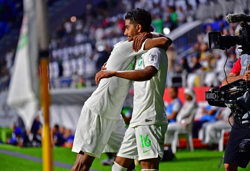 Saudi Arabia's Hussain Al Moqahwi, right, celebrates after scoring against Lebanon at Al Maktoum Stadium in Dubai. AFP