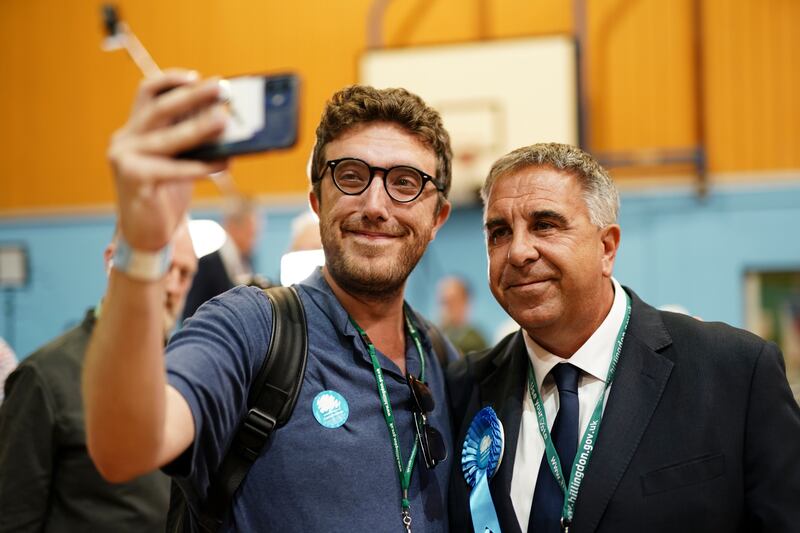 Conservative MP Steve Tuckwell poses for selfies after winning the Uxbridge and South Ruislip by-election. PA