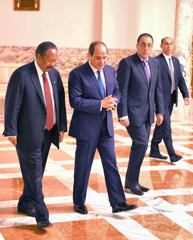 CAIRO, EGYPT - SEPTEMBER 18: (----EDITORIAL USE ONLY  MANDATORY CREDIT - "EGYPTIAN PRESIDENCY / HANDOUT" - NO MARKETING NO ADVERTISING CAMPAIGNS - DISTRIBUTED AS A SERVICE TO CLIENTS----) Sudanese Prime Minister Abdalla Hamdok (L) walks with Egyptian President, Abdel Fattah al-Sisi (2nd L) during their meeting at the Al Ittihadiyah Palace in Cairo, Egypt on September 18, 2019. (Photo by Egyptian Presidency / Handout/Anadolu Agency via Getty Images)