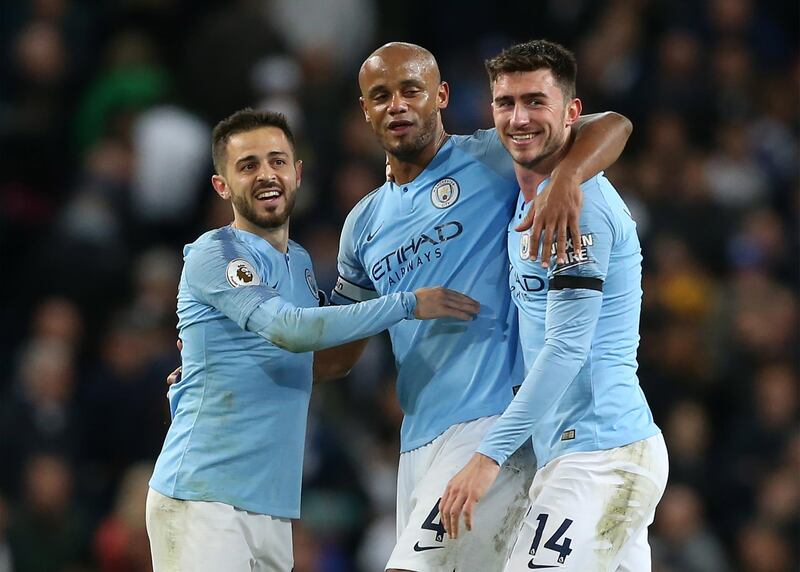 epa07551958 Manchester City's Vincent Kompany (C) celebrates with Bernardo Silva (L) and Aymeric Laporte (R) winning the English Premier League soccer match between Manchester City and Leicester City at the Etihad Stadium in Manchester, Britain, 06 May 2019.  EPA/NIGEL RODDIS EDITORIAL USE ONLY.  No use with unauthorized audio, video, data, fixture lists, club/league logos or 'live' services. Online in-match use limited to 120 images, no video emulation. No use in betting, games or single club/league/player publications.