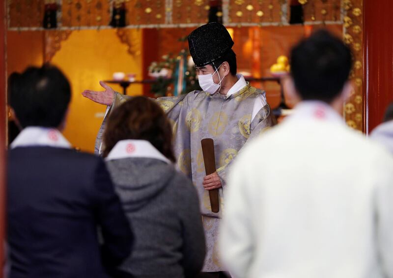 A Shinto priest prepares for a ceremony for companies wishing for prosperous business on the first business day of the new year at the Kanda Myojin shrine in Tokyo, Japan. Reuters