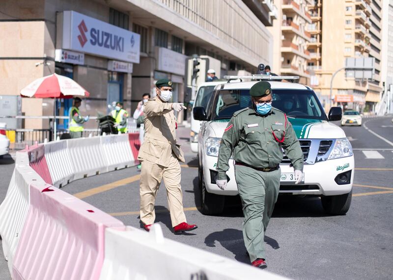 DUBAI, UNITED ARAB EMIRATES. 31 MARCH 2020. 
Dubai Police have halted traffic from enterning Al Ras. Dubai’s Supreme Committee of Crisis and Disaster Management announced increased restrictions on movement in Al Ras area of Dubai for two weeks effective from today to facilitate intensified sterilisation procedures. 

@DubaiPoliceHQ
 appeals to the public to cooperate fully with the authorities and abide by all instructions to ensure the preventive measures implemented during the two-week period are a success. People who are not residents of Al Ras are prohibited from travelling to the area.

RTA closed entrances leading to Al Ras area from three main roads and interchanges: Al Musalla, Al Khaleej, and Baniyas Streets. The plan also includes the closure of three stations on the metro green line: Al Ras, Palm Deira and Baniyas Square.

(Photo: Reem Mohammed/The National)

Reporter: NICK WEBSTER
Section: COVID NA 