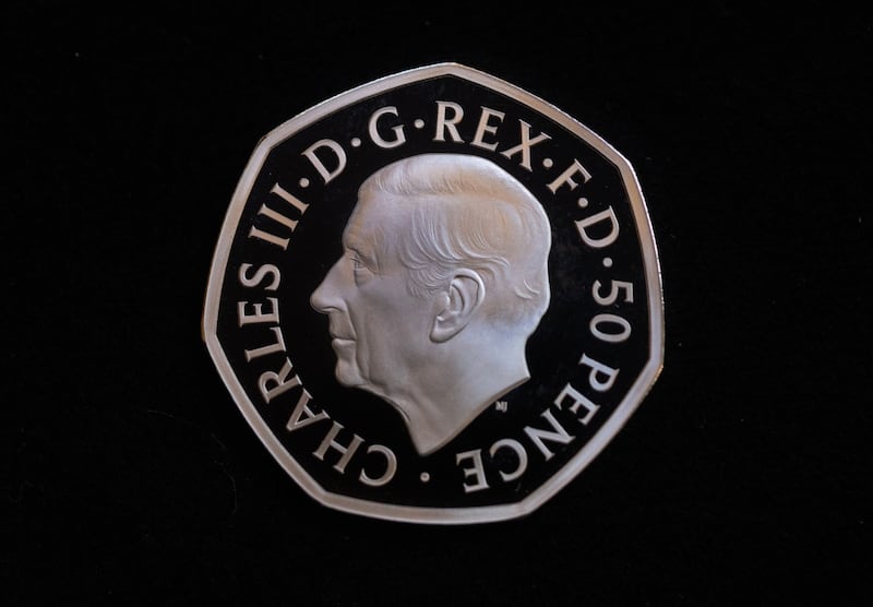 A 50p coin featuring the head of King Charles III displayed by the Royal Mint in London. Bloomberg
