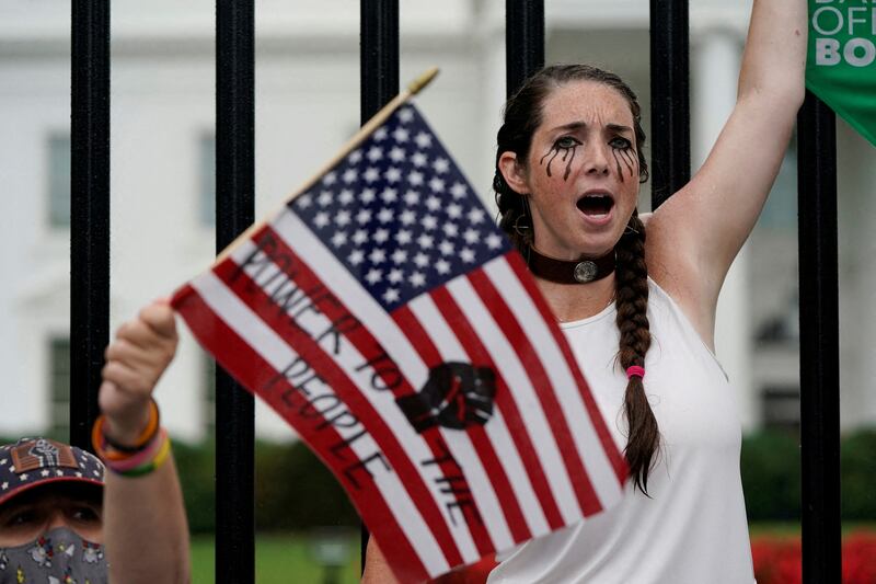 A demonstrator shouts outside the White House during a Women's March protest in the wake of the US Supreme Court overturning Roe v Wade. Reuters