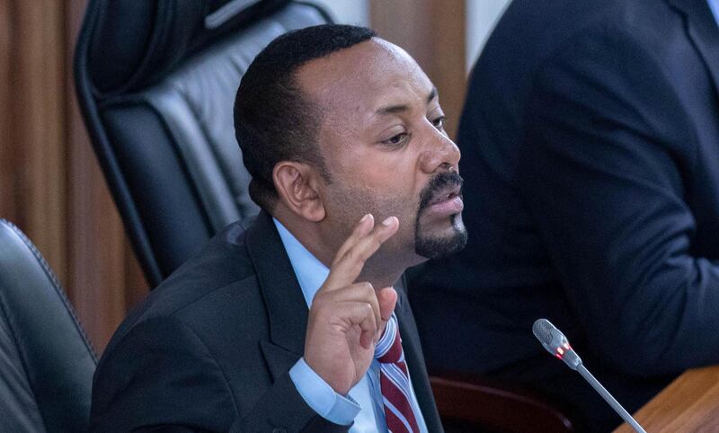 FILE - In this Tuesday, Oct. 22, 2019 file photo, Ethiopian Prime Minister Abiy Ahmed addresses members of parliament on the current situation in the country inside the Parliament buildings, in Addis Ababa, Ethiopia. Ethiopia's Nobel Peace Prize-winning prime minister urged calm on Wednesday, Nov. 20, 2019 as millions of citizens held a referendum on whether to create a new regional state along ethnic lines. (AP Photo/Mulugeta Ayene, File)