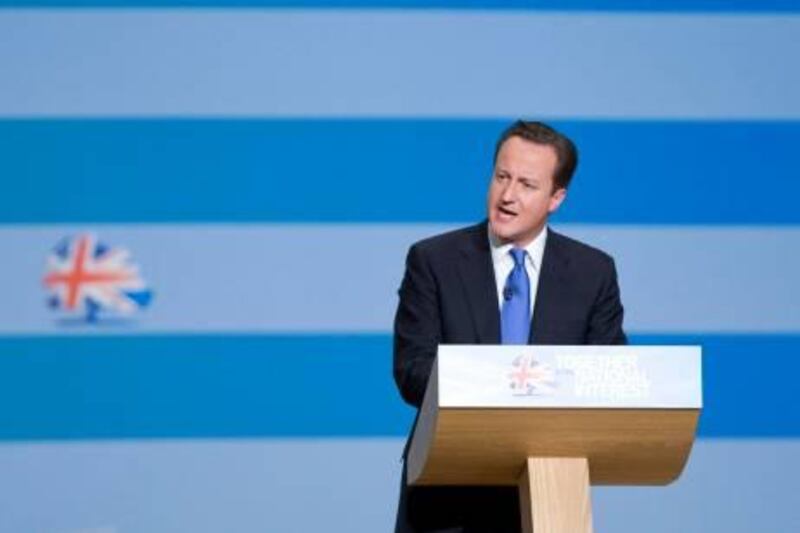 David Cameron, U.K. prime minister, speaks at the Conservative party's annual conference in Birmingham, U.K., on Wednesday, Oct. 6, 2010. Cameron ended his first Conservative Party conference as U.K. premier on the defensive after reversing a pledge to pay child benefit to all mothers and then apologizing for not telling voters before the May election. Photographer: Chris Ratcliffe/Bloomberg *** Local Caption *** David Cameron 744298.jpg