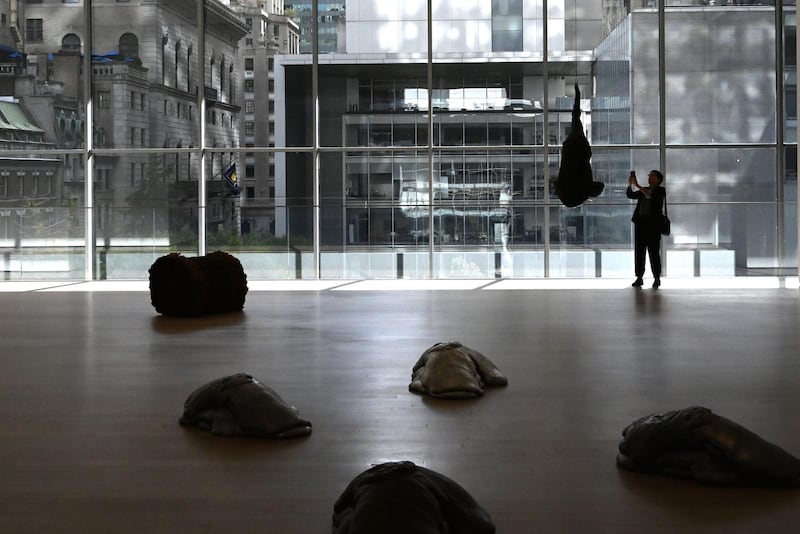 A member of the media walks through one of the galleries at the newly expanded Moma. AFP