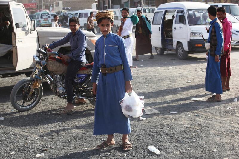 In this Friday, Feb. 2, 2018, photograph, a young Yemeni man leaves a shop in Marib, Yemen. Yemen's conflict, which began as a civil war in 2014 and escalated into a regional proxy fight, drags on today. Winning the hardscrabble terrain takes time and costs dearly, only exacerbating the country's humanitarian crises and making a war that's seen over 10,000 people killed last that much longer. (AP Photo/Jon Gambrell)