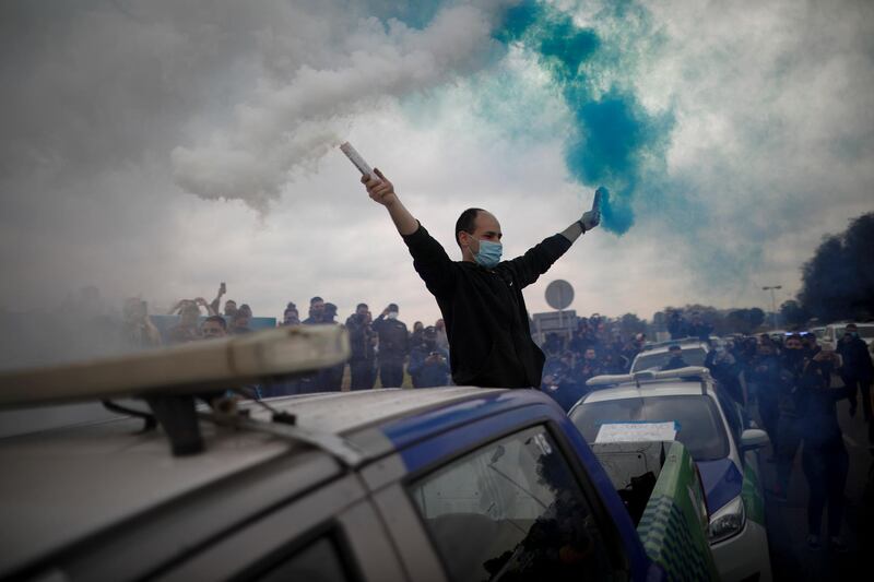 Buenos Aires provincial police light flares as they stage a protest demanding better wages and working conditions in La Matanza, on the outskirts of Buenos Aires, Argentina. AP Photo