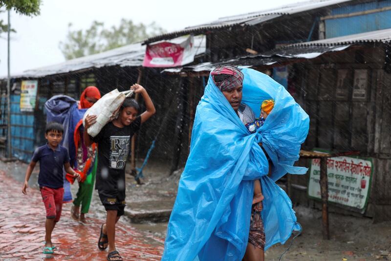 People make their way to a safer place before the cyclone Amphan makes its landfall in Gabura outskirts of Satkhira district, Bangladesh. Reuters