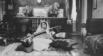 This handout picture received from Shrabani Basu at the Noor Inayat Khan Memorial trust on November 8, 2012 shows late former British secret agent Noor Inayat Khan playing a Veena. A statue of Noor Inayat Khan was unveiled in Gordon Square Gardens, central London on November 8, 2012 in London, England by Princess Anne. Noor Inayat Khan worked as a radio operator for the Women's Auxiliary Air Force before being recruited by the Special Operations Executive as an agent, working behind enemy lines in Paris, France. She was eventually captured, tortured and beaten before being executed at Dachau Concentration Camp, aged 30.  Ã¬ RESTRICTED TO EDITORIAL USE - MANDATORY CREDIT  " AFP PHOTO / Noor Inayat Khan Memorial trust/Shrabani Basu  "  -  NO MARKETING NO ADVERTISING CAMPAIGNS   -   DISTRIBUTED AS A SERVICE TO CLIENTS Ã® (Photo by HO / Noor Inayat Khan Memorial trust / AFP)