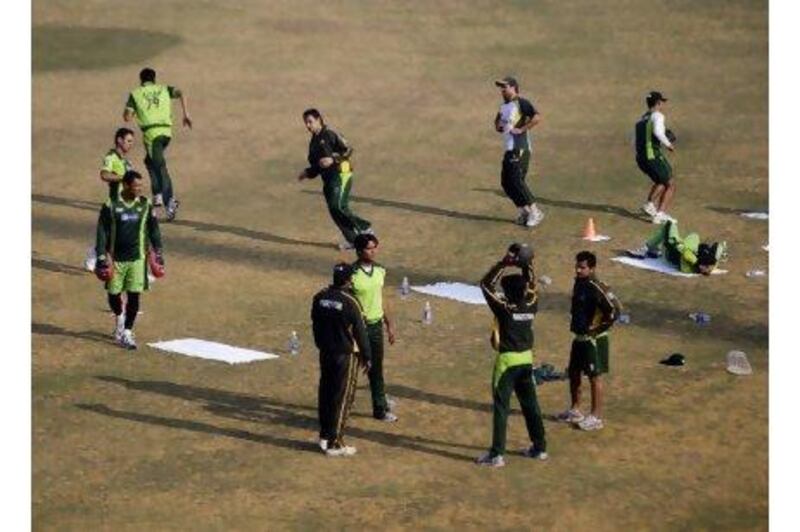 Pakistani cricket players take part in a practice session in Lahore, Pakistan, on Wednesday.