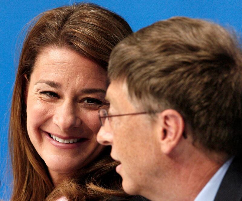 Melinda Gates smiles at her husband Bill Gates during the opening news conference for AIDS 2006, the XVI International AIDS conference in Toronto, August 13, 2006. Reuters