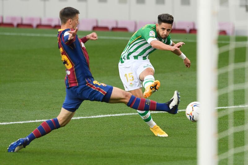Real Betis' defender Alex Moreno is tackled by Barcelona's defender Clement Lenglet. AFP