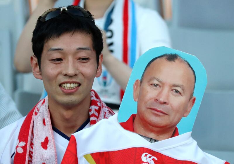 A fan waits for the Pool C game between England and Argentina in Tokyo. Associated Press