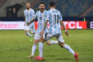 Argentina's Lionel Messi (L) celebrates with Argentina's Angel Di Maria after scoring against Ecuador during their Conmebol 2021 Copa America football tournament quarter-final match at the Olympic Stadium in Goiania, Brazil, on July 3, 2021.  (Photo by NELSON ALMEIDA  /  AFP)