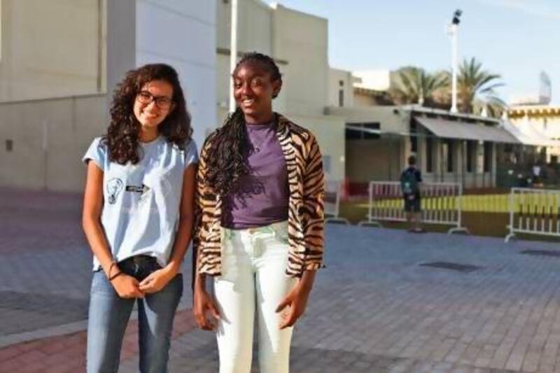 Lamia Makkar, left, and Tasneem Zarroug, pupils at the American Community School of Abu Dhabi, will work through their spring break, babysitting, tutoring and baking to raise money for a trip to Haiti, during which they will help a village rebuild and recover from the 2010 earthquake. Lee Hoagland / The National