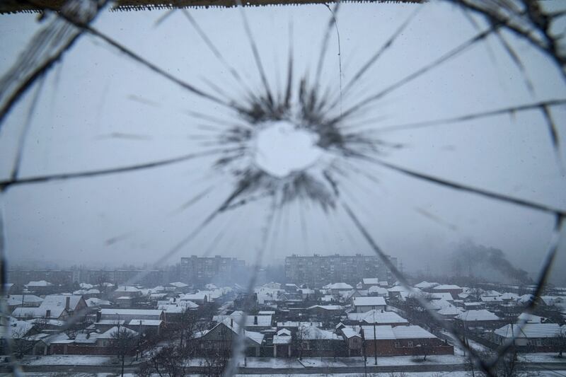 A hospital window is cracked from shelling. AP Photo