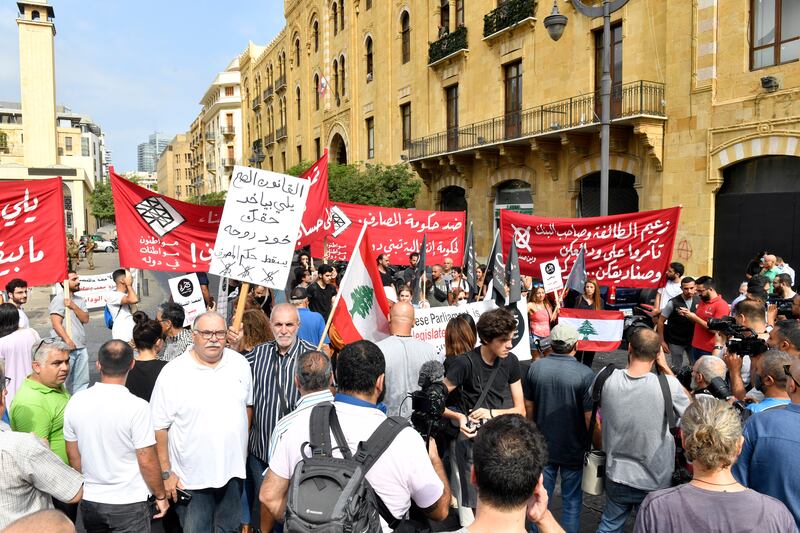 Bank customers at a protest outside the Lebanese Parliament in Beirut. Their deposits were frozen as the Lebanese pound lost about 90 per cent of its value against the dollar. EPA