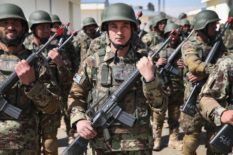 Soldiers with the Afghan National Army (ANA) graduate from basic training during a ceremony at the ANA’s combined fielding centre in Kabul. Scott Olson / Getty / March 18, 2014