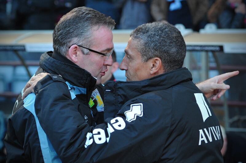 Norwich City's English manager Chris Hughton (R) greets Aston Villa's Scottish manager Paul Lambert (L) before the English Premier League football match between Aston Villa and Norwich City at Villa Park in Birmingham, West Midlands, England on October 27, 2012. The game ended 1-1. AFP PHOTO/CARL COURT

RESTRICTED TO EDITORIAL USE. No use with unauthorized audio, video, data, fixture lists, club/league logos or “live” services. Online in-match use limited to 45 images, no video emulation. No use in betting, games or single club/league/player publications.
 *** Local Caption ***  764950-01-08.jpg