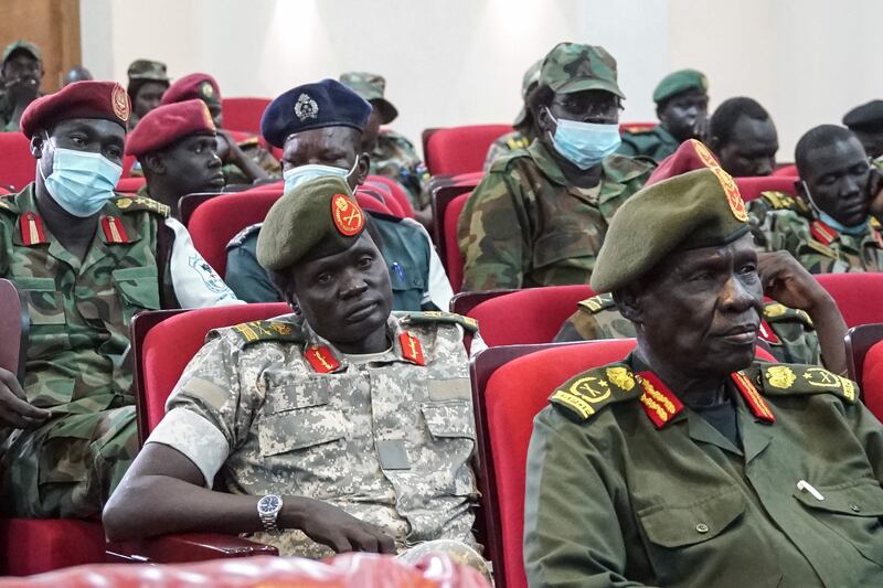 Members of South Sudan's armed forces attend a joint security meeting in the capital Juba last month to help de-escalate tensions in the country. AFP