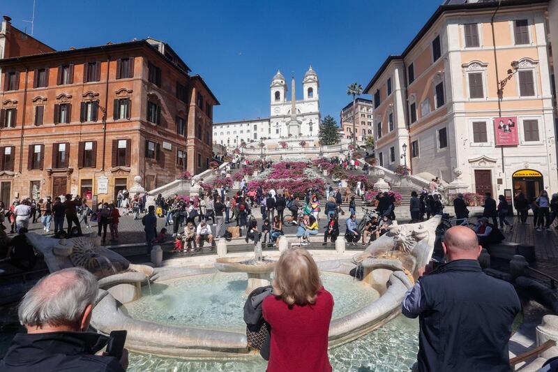 People enjoy a sunny day at the Spanish Steps during the last weekend in the orange zone, in Rome, Italy. Most of Italy is set for a significant easing of its Covid-19 colour-coded restrictions from April 26, 2021. EPA