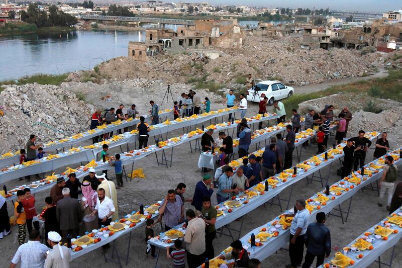 People gather to break their fast in Mosul, Iraq. Reuters