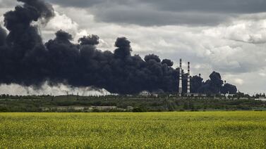 Smoke rises from an oil refinery after an attack in the eastern Ukranian region of Donbas. AFP