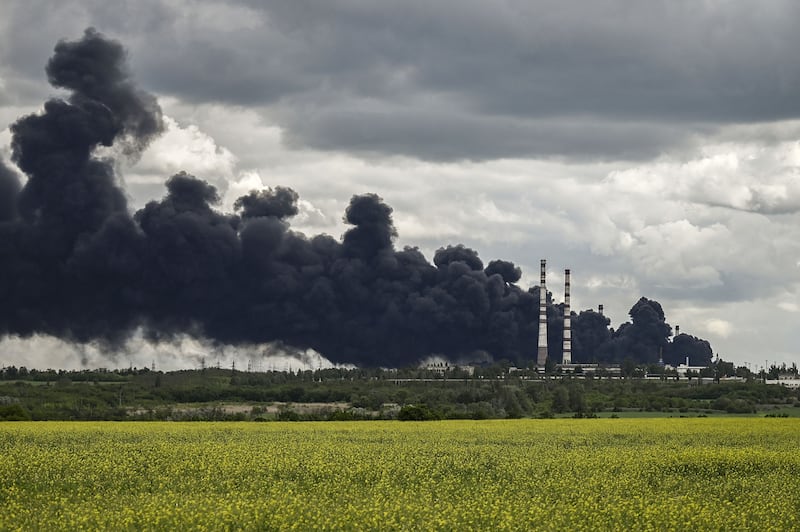 Smoke rises from an oil refinery after an attack in the eastern Ukranian region of Donbas. AFP