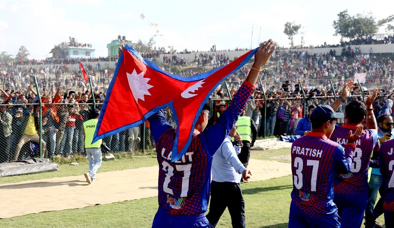 Nepal players celebrate in front of a packed Mulpani Cricket Ground in Kathmandu.