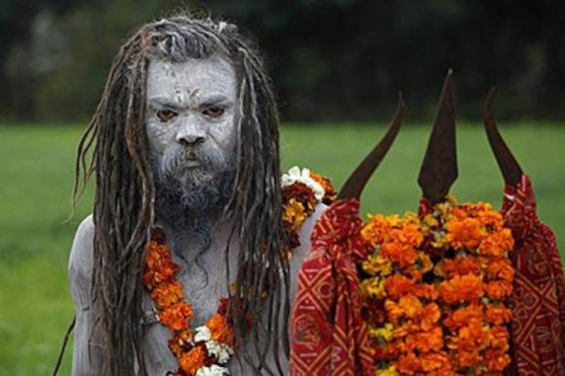 A naga baba, one of the millions of Hindu ascetics who participate in the festival's immersion rituals, joins the procession to Haridwar.