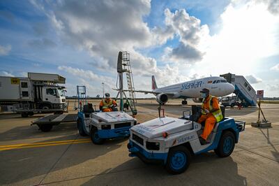 Ground staff at Colombo International Airport where SriLankan Airlines hopes a new terminal will be built. AFP