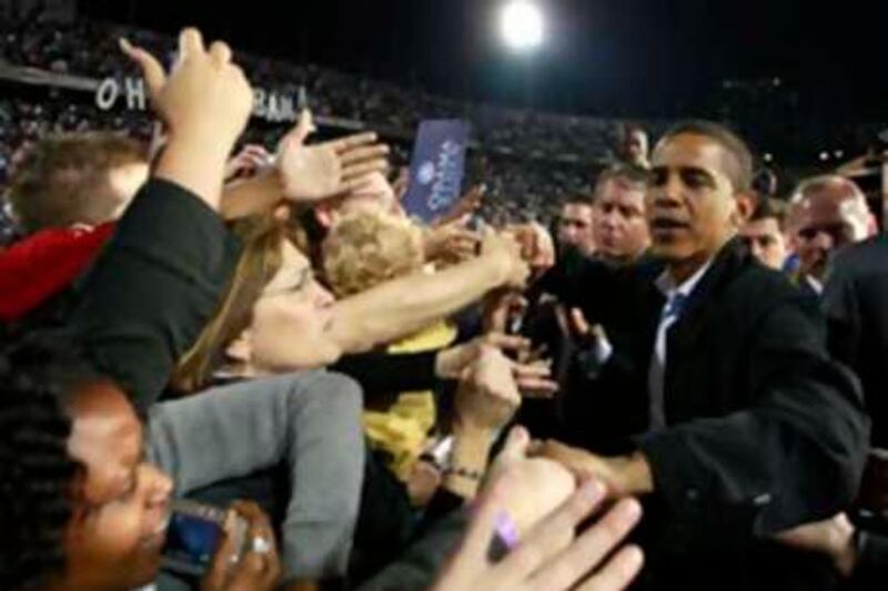 U.S. Democratic presidential nominee Senator Barack Obama (D-IL) greets supporters at a campaign rally in Cincinnati, Ohio, November 2, 2008.      REUTERS/Jason Reed     (UNITED STATES)    US PRESIDENTIAL ELECTION CAMPAIGN 2008     (USA) *** Local Caption ***  OBA73_USA-POLITICS-_1103_11.JPG