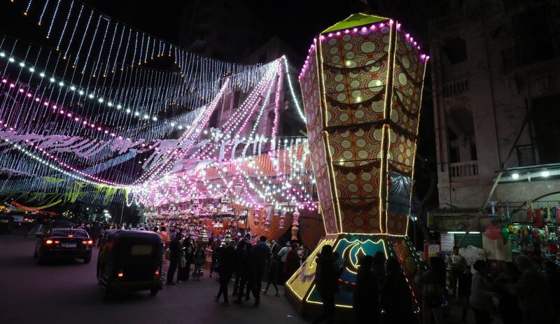 Egyptians buy fanous decorations at a market in Cairo. EPA