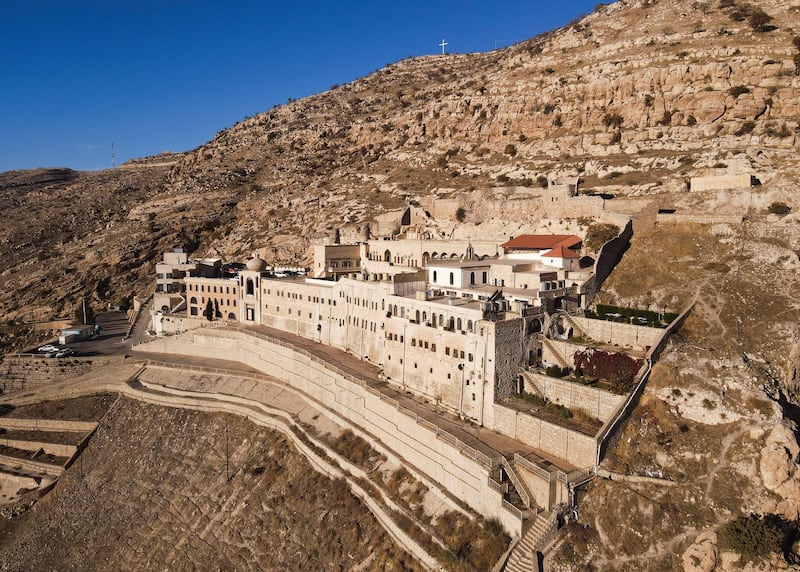 An aerial picture shows a view of the historic Syriac Orthodox monastery of St.  Matthew, known in Arabic as Deir Mar Matta, on Jabal Maqlub, some 30 kms northeast of the northern Iraqi city of Mosul, on December 12, 2021.  (Photo by Zaid AL-OBEIDI  /  AFP)