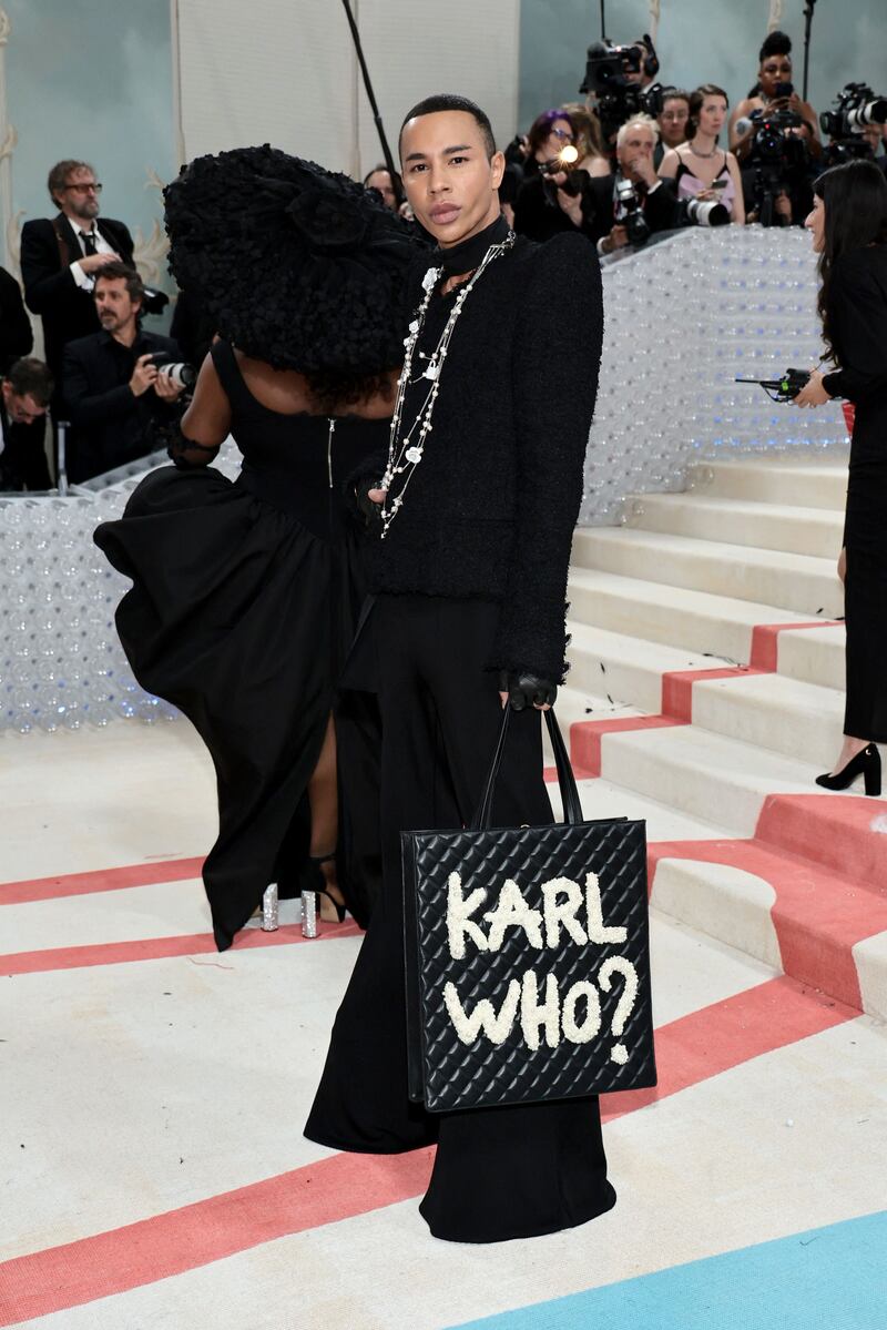 Designer Olivier Rousteing carries a 'Karl who?' bag. AFP